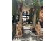 Stunning lobby with palm trees, decorative statues, and comfortable seating at 7535 Brooklyn Dr, Kissimmee, FL 34747