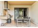 Covered outdoor kitchen offers a dining area and grilling area at 7535 Brooklyn Dr, Kissimmee, FL 34747