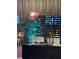 Modern reception area featuring a neon sign, stylish decor, and wood paneling at 7535 Brooklyn Dr, Kissimmee, FL 34747