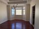 Bright dining room with hardwood floors and a bay window offering a scenic view at 8749 The Esplanade # 29, Orlando, FL 32836