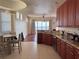 Well-equipped kitchen with granite countertops and wooden cabinetry at 8749 The Esplanade # 29, Orlando, FL 32836