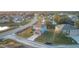 Aerial view of two-story house with attached garage, located in a residential neighborhood at 1001 Dampierre Ct, Kissimmee, FL 34759