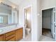 Main bathroom with double sinks, toilet and closet at 1001 Dampierre Ct, Kissimmee, FL 34759