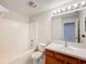 Clean bathroom with tub, sink, and vanity at 1001 Dampierre Ct, Kissimmee, FL 34759