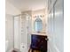 Bathroom with shower, vanity, and round mirror at 1001 Dampierre Ct, Kissimmee, FL 34759