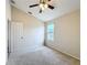Bedroom with vaulted ceiling, window, and closet at 1001 Dampierre Ct, Kissimmee, FL 34759