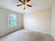 Bright bedroom with ceiling fan and window at 1001 Dampierre Ct, Kissimmee, FL 34759