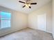 Bright bedroom with ceiling fan and window view at 1001 Dampierre Ct, Kissimmee, FL 34759