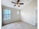 Bedroom with large window and ceiling fan at 1001 Dampierre Ct, Kissimmee, FL 34759