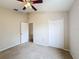 Bedroom with double door closet and window at 1001 Dampierre Ct, Kissimmee, FL 34759