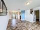 Dining room with wood-look floors and access to kitchen at 1001 Dampierre Ct, Kissimmee, FL 34759