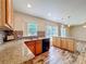 Kitchen boasts granite countertops and stainless steel appliances at 1001 Dampierre Ct, Kissimmee, FL 34759