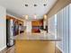 Kitchen island with granite countertop and pendant lighting at 1001 Dampierre Ct, Kissimmee, FL 34759