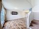 Spacious living room with wood-look floors and staircase at 1001 Dampierre Ct, Kissimmee, FL 34759