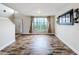 Bright living room with tile floors and large window at 1001 Dampierre Ct, Kissimmee, FL 34759