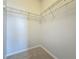 Large walk-in closet with wire shelving at 10710 Savannah Wood Dr # 107, Orlando, FL 32832