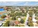 Aerial perspective of a neighborhood near a lake and tennis courts at 112 Azalea Ln, Sanford, FL 32773