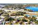 Aerial view showing a neighborhood, park, and nearby road with businesses at 112 Azalea Ln, Sanford, FL 32773