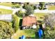 Aerial view showcasing a house's backyard, shed, and surrounding landscape at 112 Azalea Ln, Sanford, FL 32773