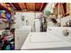 Unfinished basement with laundry appliances and storage at 112 Azalea Ln, Sanford, FL 32773