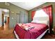 Cozy bedroom with a red bedspread and star ceiling at 112 Azalea Ln, Sanford, FL 32773