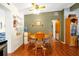 Charming dining room with wood table and chairs, and hardwood floors at 112 Azalea Ln, Sanford, FL 32773