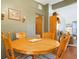 Bright dining area with round wood table and four chairs at 112 Azalea Ln, Sanford, FL 32773