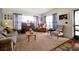Living room with brown corduroy couch and a piano at 112 Azalea Ln, Sanford, FL 32773
