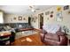 Living room with grey sectional and brown recliner at 112 Azalea Ln, Sanford, FL 32773