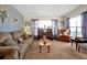 Living room with brown corduroy couch and a piano at 112 Azalea Ln, Sanford, FL 32773