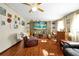 Living room with grey sectional sofa and wood flooring at 112 Azalea Ln, Sanford, FL 32773