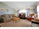 Living room with brown corduroy couch and a piano at 112 Azalea Ln, Sanford, FL 32773