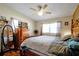 Spacious main bedroom with a wooden post bed and large windows at 112 Azalea Ln, Sanford, FL 32773
