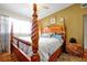 Main bedroom featuring a wooden post bed, and ceiling fan at 112 Azalea Ln, Sanford, FL 32773