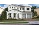 Two-story house with gray garage and white siding at 13188 Faro Ct # 42, Winter Garden, FL 34787