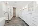 Spacious bathroom featuring dual vanities, soaking tub, walk-in shower, and tile flooring at 13200 Faro Ct # 44, Winter Garden, FL 34787