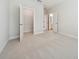 Spacious bedroom with plush carpeting, closet, and open doorway to bathroom for easy access at 13200 Faro Ct # 44, Winter Garden, FL 34787
