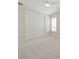 Bright bedroom featuring a ceiling fan, a closet with sliding doors, neutral walls and plush carpeting at 13200 Faro Ct # 44, Winter Garden, FL 34787