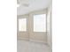 Airy bedroom featuring plush carpeting, two windows, and a ceiling fan for optimal comfort at 13200 Faro Ct # 44, Winter Garden, FL 34787
