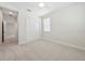 Comfortable bedroom features plush carpet, a window with blinds, and a closet for storage at 13200 Faro Ct # 44, Winter Garden, FL 34787