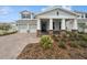 Charming two-story home with a welcoming front porch, manicured landscaping, and a two-car garage at 13200 Faro Ct # 44, Winter Garden, FL 34787