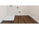 Laundry room boasts stylish wood-look tile flooring and convenient washer/dryer hookups for easy chore management at 13200 Faro Ct # 44, Winter Garden, FL 34787