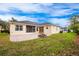 Home's backyard features a fire pit and patio at 13442 Old Dock Rd, Orlando, FL 32828