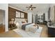 Main bedroom with wood-like accent wall and sitting area at 13442 Old Dock Rd, Orlando, FL 32828