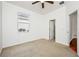Bright bedroom with neutral carpeting and ceiling fan at 13442 Old Dock Rd, Orlando, FL 32828