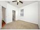 Spacious bedroom with ceiling fan and carpet at 13442 Old Dock Rd, Orlando, FL 32828
