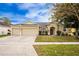 Attractive single-story home with two-car garage and landscaped lawn at 13442 Old Dock Rd, Orlando, FL 32828