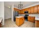 Modern kitchen with stainless steel appliances and an island at 13442 Old Dock Rd, Orlando, FL 32828