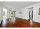 Bright living room with hardwood floors and sliding glass doors leading to the backyard at 13442 Old Dock Rd, Orlando, FL 32828