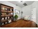 Home office featuring built-in shelving and hardwood floors at 13442 Old Dock Rd, Orlando, FL 32828